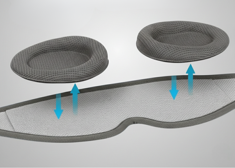 Gray Rest'd mesh cushion with two circular pads and blue arrows indicating airflow on a light gray background